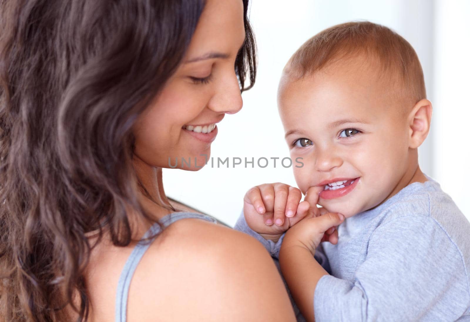 Cropped image of a mother holding her little boy.