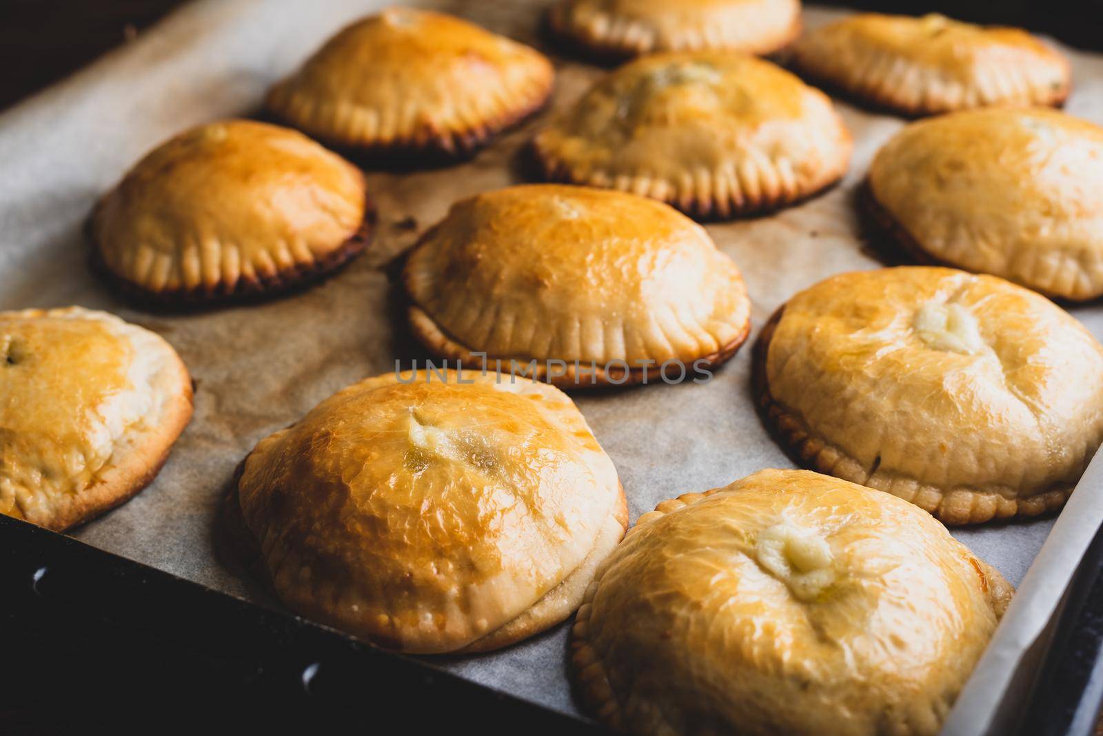 Oven Baked Hand Pies with Leek and Mushrooms on Baking Sheet