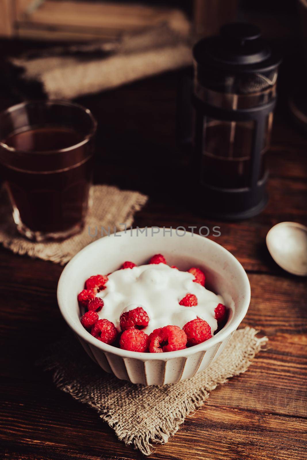 Dessert with Fresh Raspberry and Sour Cream in Bowl and Glass of Coffee