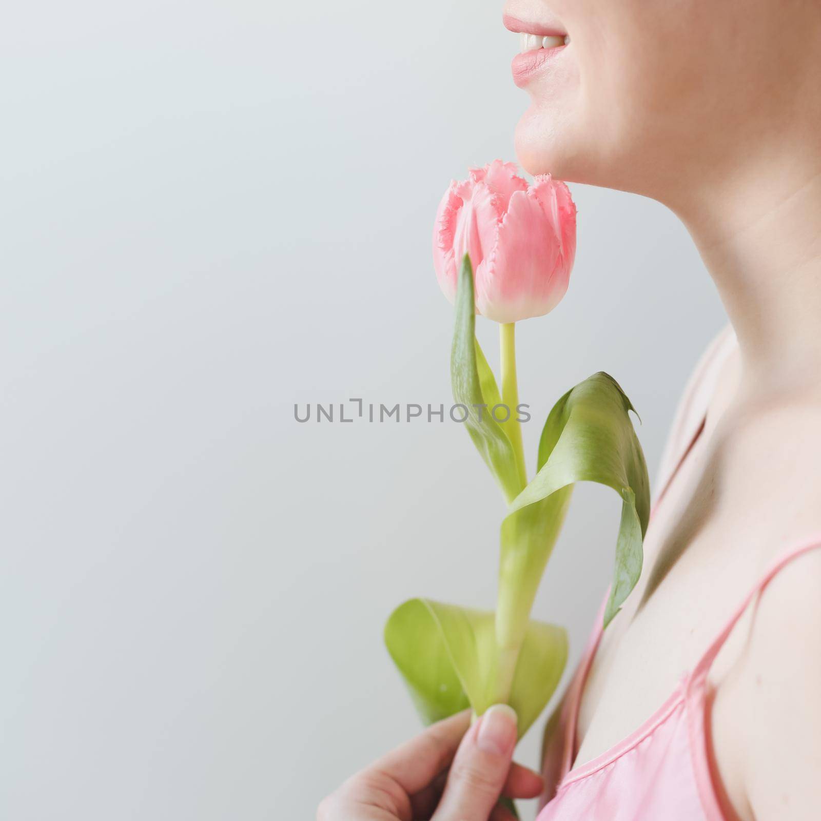 romantic tender portrait of a young woman with pink fresh tulips. by paralisart