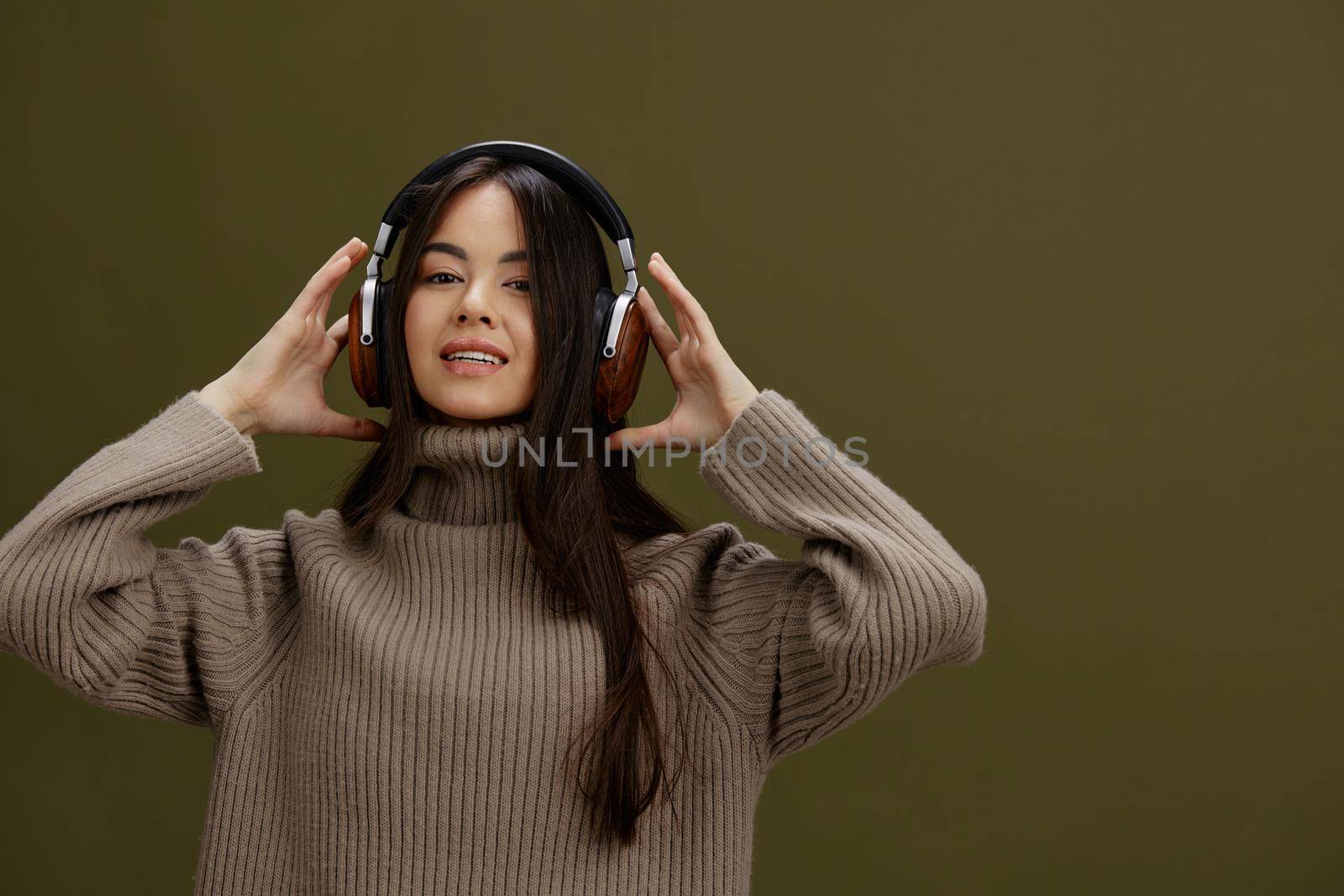 woman in headphones listening to music emotions Lifestyle by SHOTPRIME