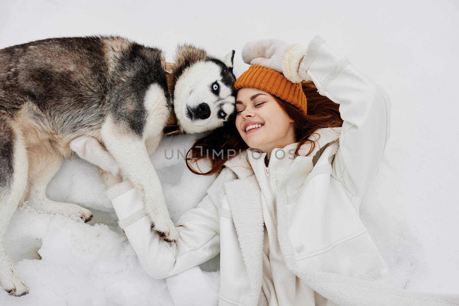 portrait of a woman winter clothes walking the dog in the snow fresh air by SHOTPRIME