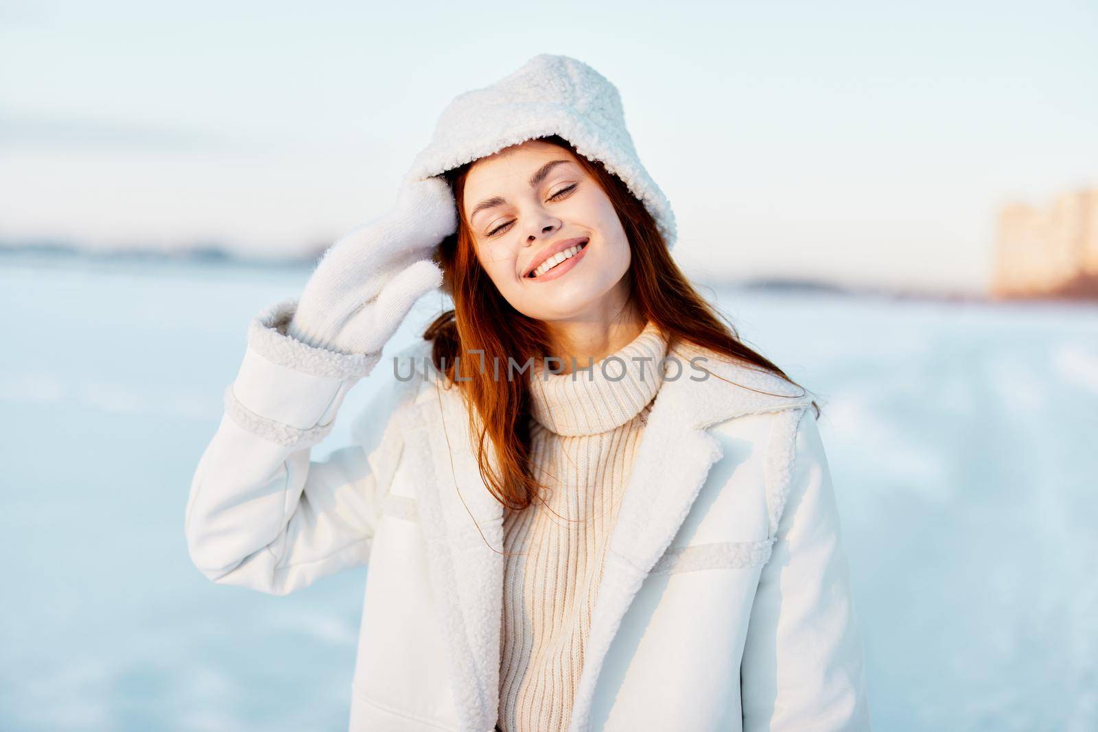 beautiful woman winter weather snow posing nature rest Fresh air. High quality photo
