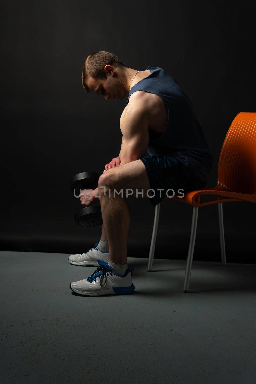 Man on black background keeps dumbbells pumped up in fitness muscle sexy torso, athlete muscular man athletic dumbbell, shirtless skin power, people fit by 89167702191