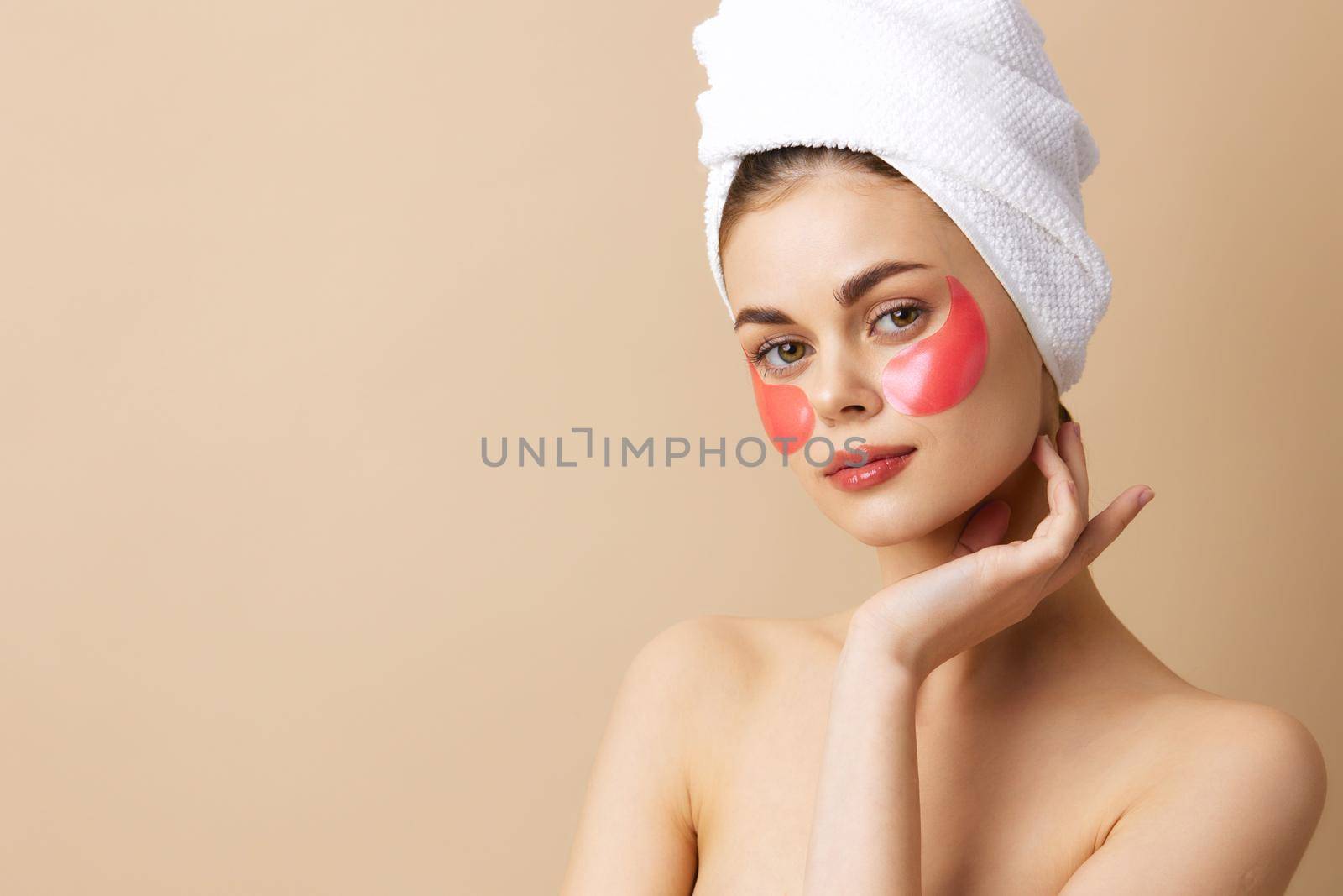 portrait woman pink patches on the face with a towel on the head close-up Lifestyle. High quality photo