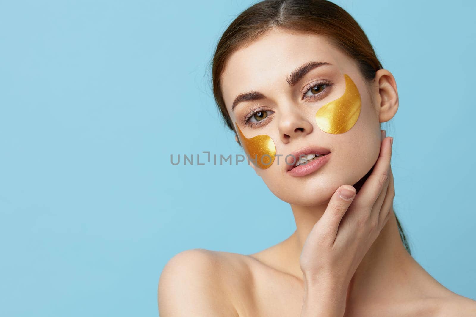 beautiful woman skin care face patches bare shoulders hygiene isolated background by SHOTPRIME