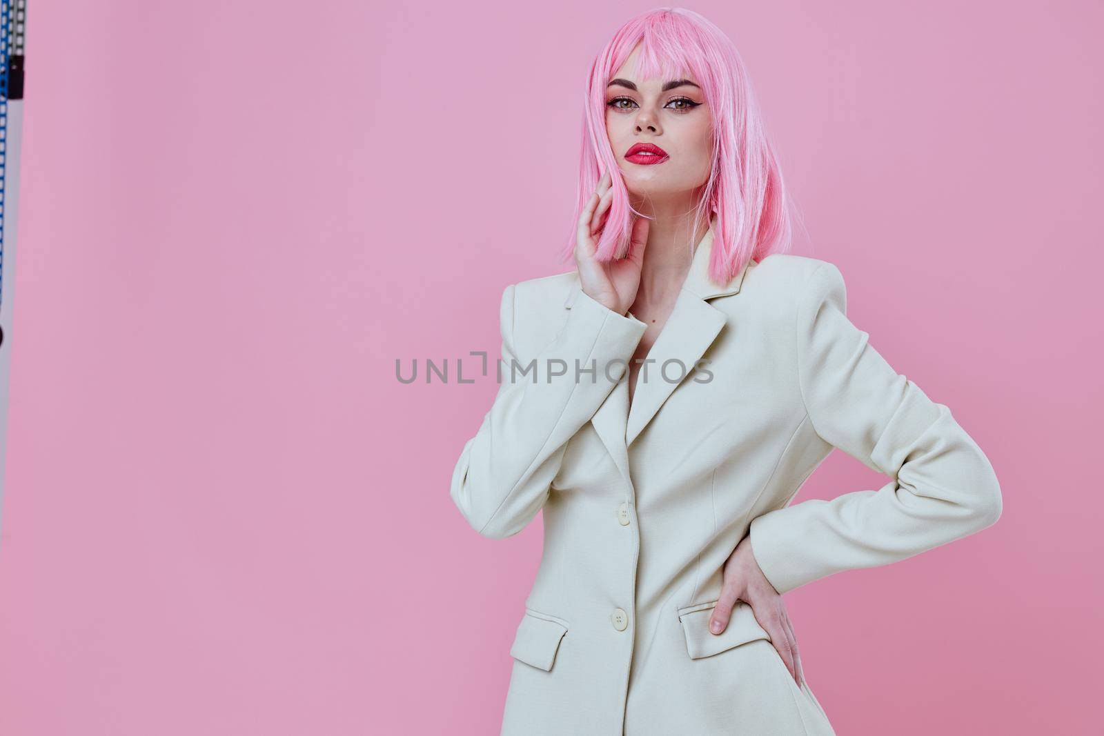 Pretty young female in White blazer pink hair Glamor Cosmetics color background unaltered by SHOTPRIME