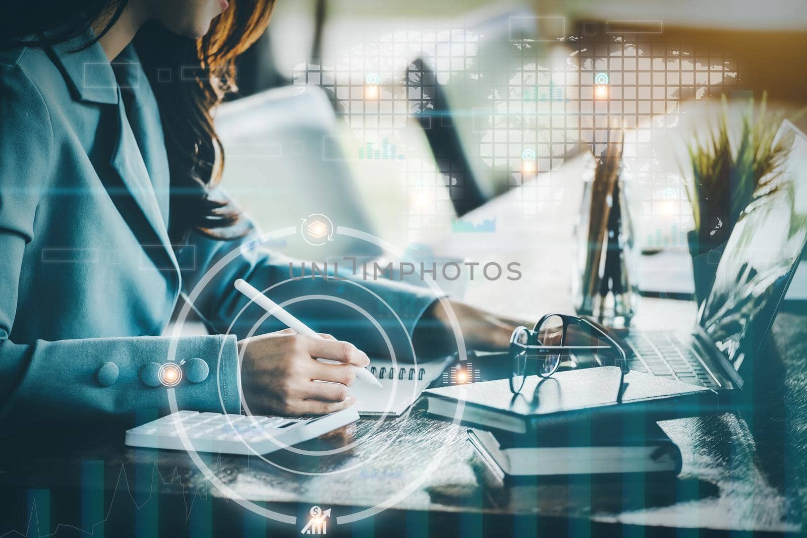 Financial planning and control concepts, women holding pen with notebook to calculate investment statements while using tablet computers to work, Using digital devices in data analysis. by Manastrong