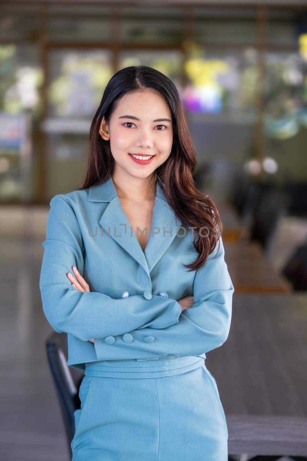 female entrepreneur showing a happy smiling face. by Manastrong