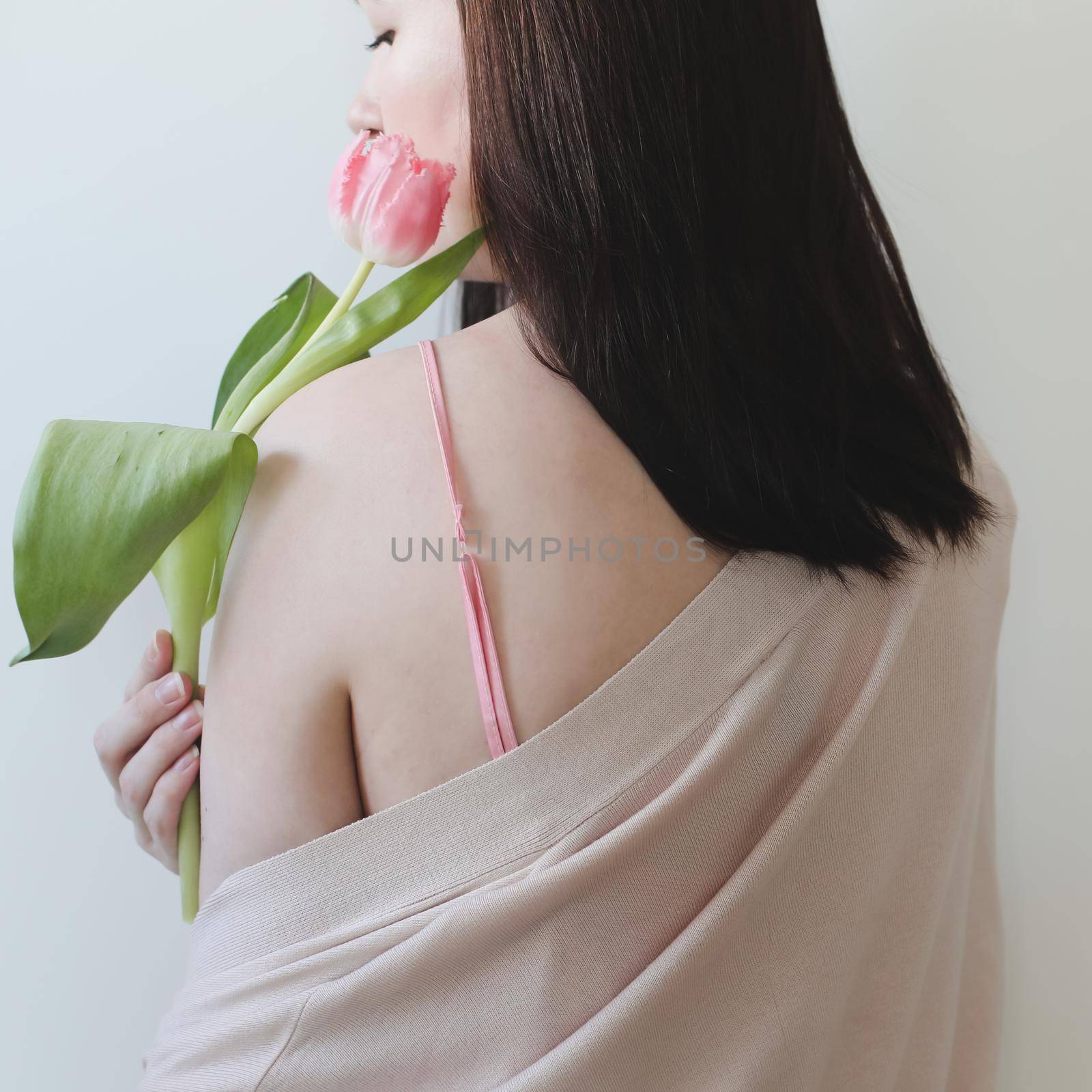 romantic tender portrait of a young woman with pink fresh tulips. by paralisart