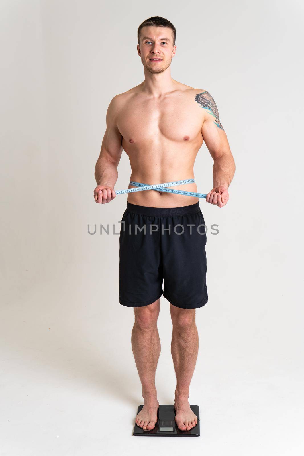 Man with weights health pondered, health and sports on a white background body ill spine male health adult, chronic. Tension neck care, disease suffer attractive