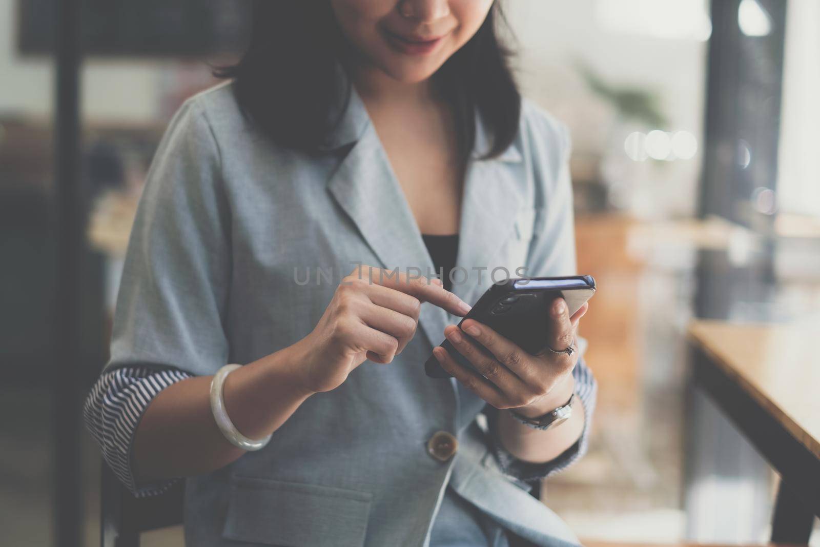 A businesswoman completes KYC using an online banking program in order to open a digital savings account. The definition of cyber security by itchaznong