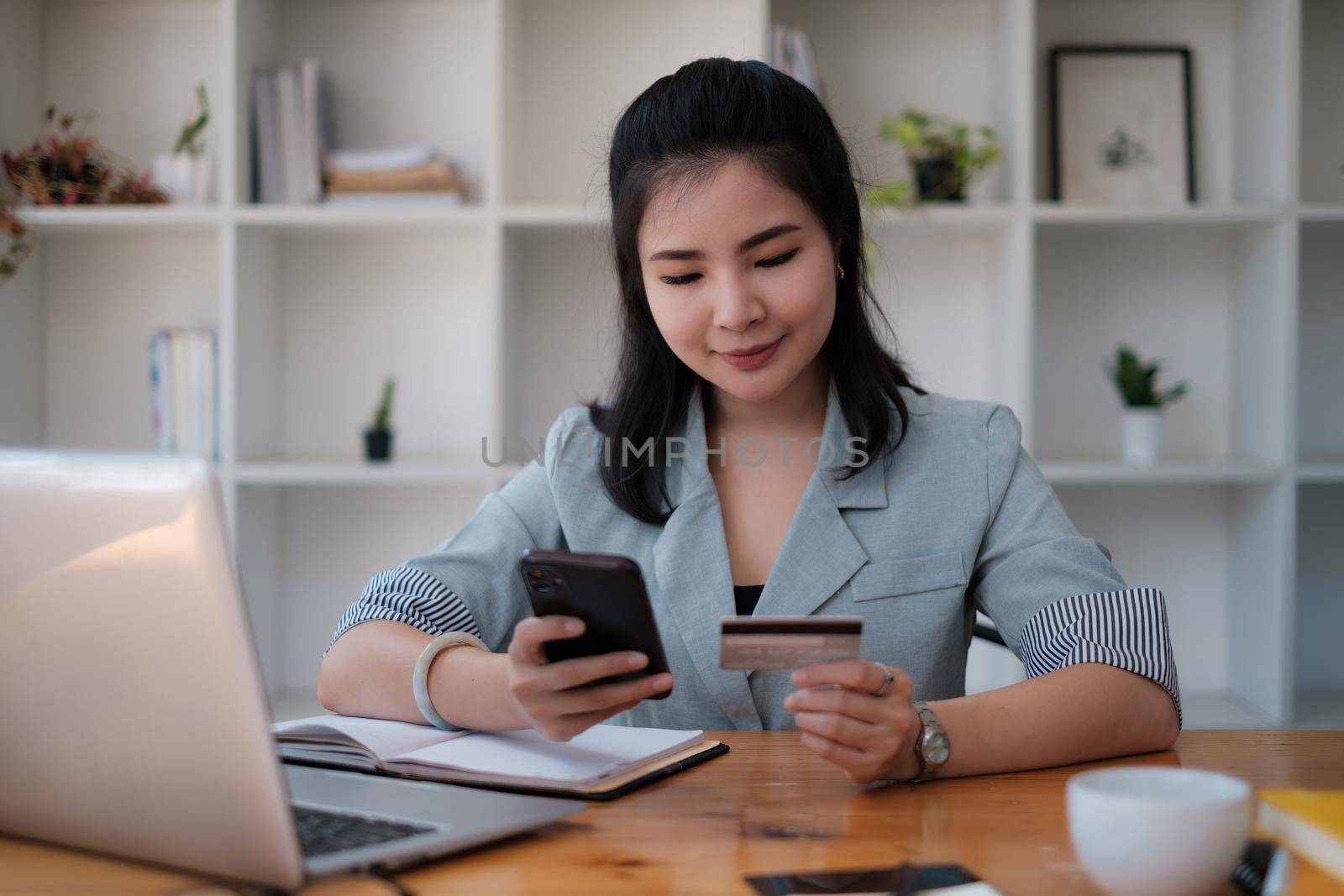 Woman enjoy with online shopping application and typing credit card for fill number to payment with virtual digital asset and metaverse