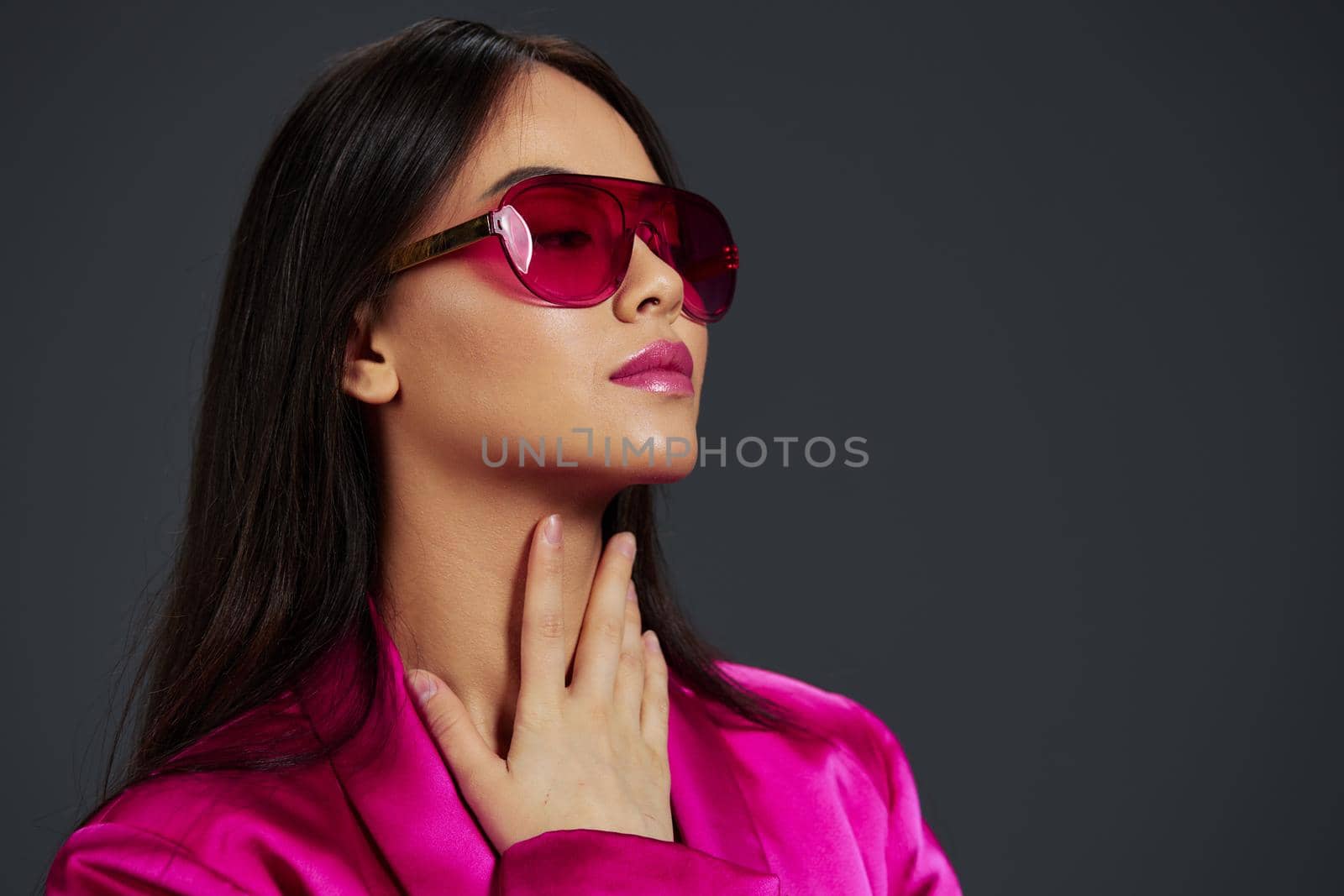 pretty woman posing pink mini dress charm sunglasses isolated background. High quality photo