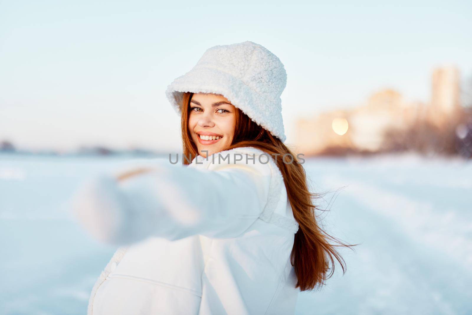 woman smile Winter mood walk white coat nature. High quality photo