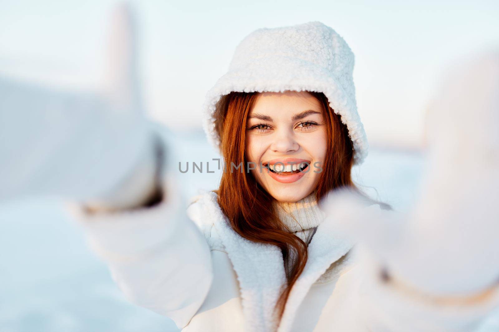 young woman red hair snow field winter clothes Fresh air. High quality photo