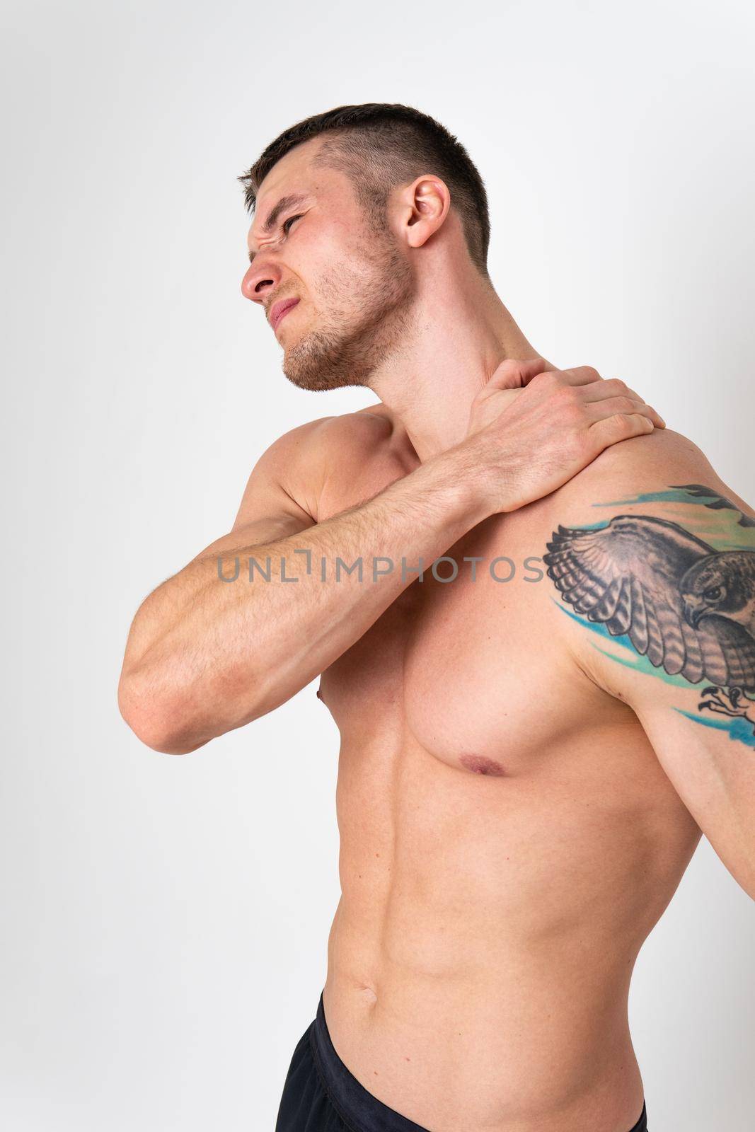 The muscles of the neck in a man on a white background are hurt back sore muscle, backache sick white massage adult, illness holding. Hold care, problem suffer attractive