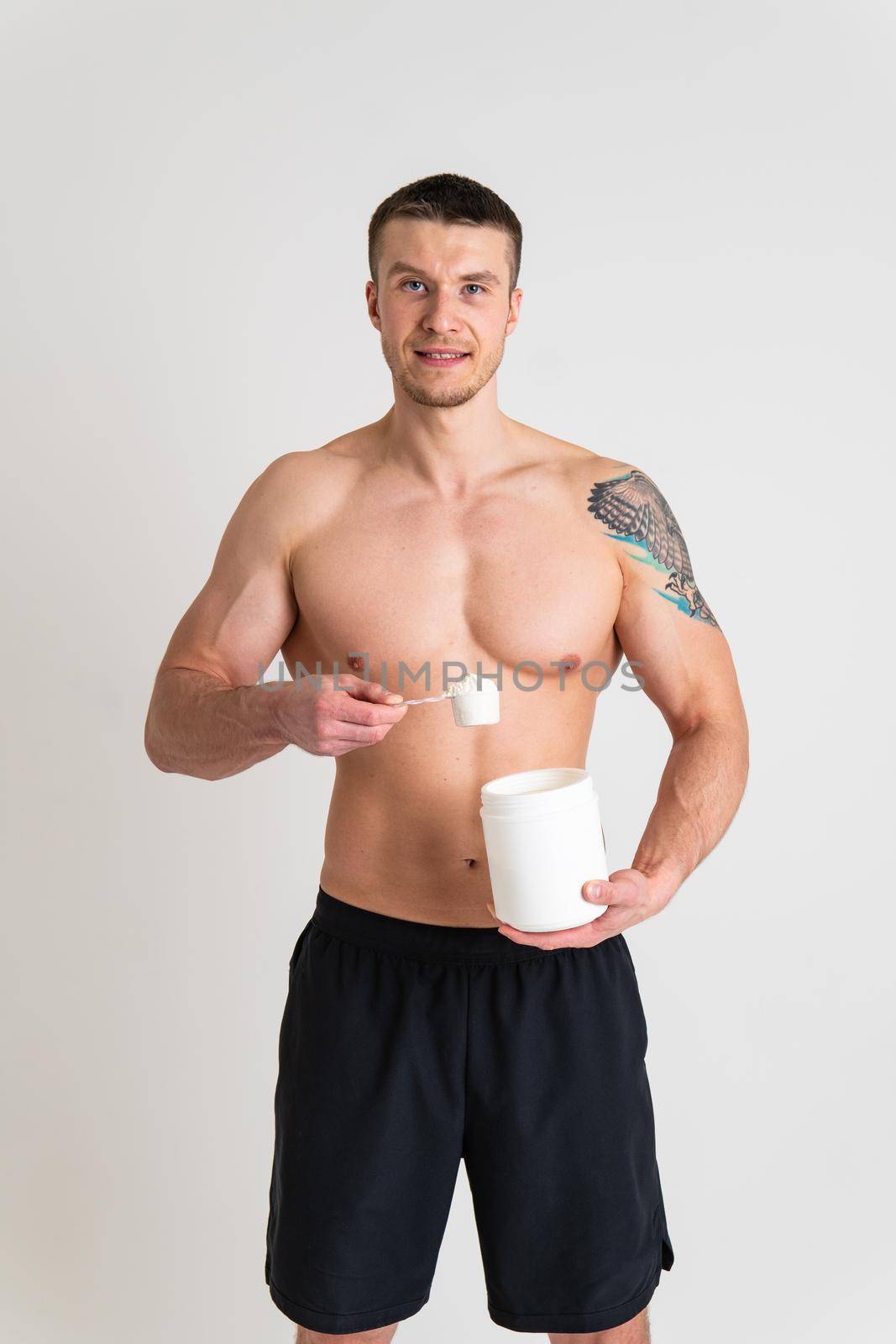 Fitness protein jars white on white background bodybuilder powder strong high pain sore injury, backache spine isolated young stress, human chronic. Touching lumbar problem suffer attractive