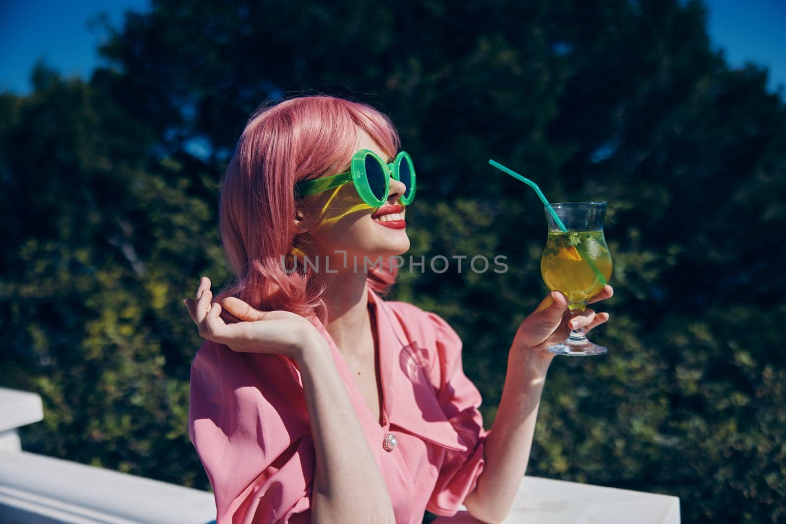 cheerful woman green glasses glamor cocktail fun Relaxation concept. High quality photo
