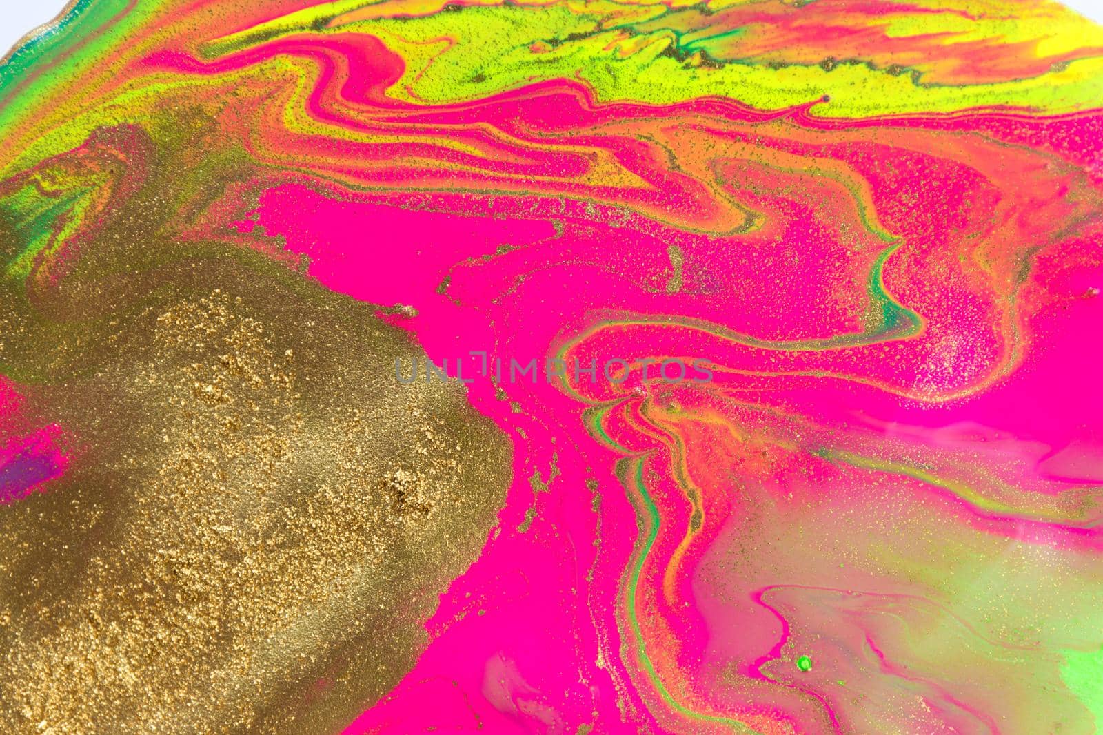 Gold spots on flow vivid paints background with bubbles. Abstract print.