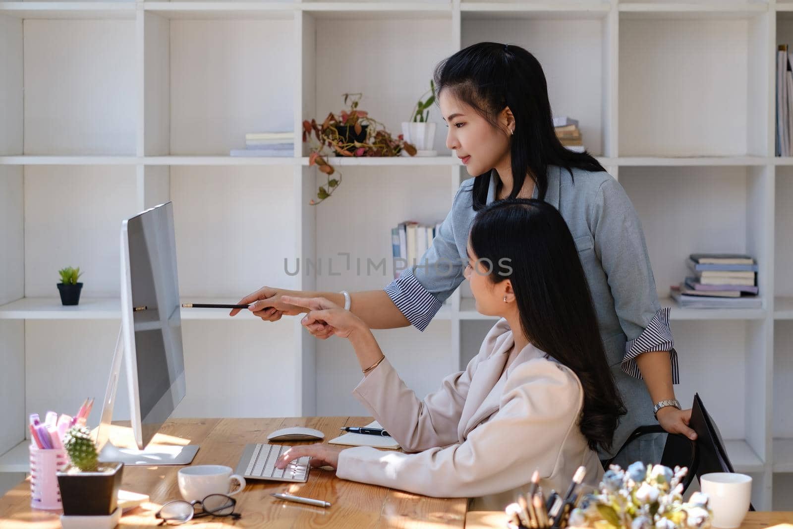 Business team discuss and offer idea the situation on the investment in the stock market. teamwork working together at friendly staff corporate meeting concept