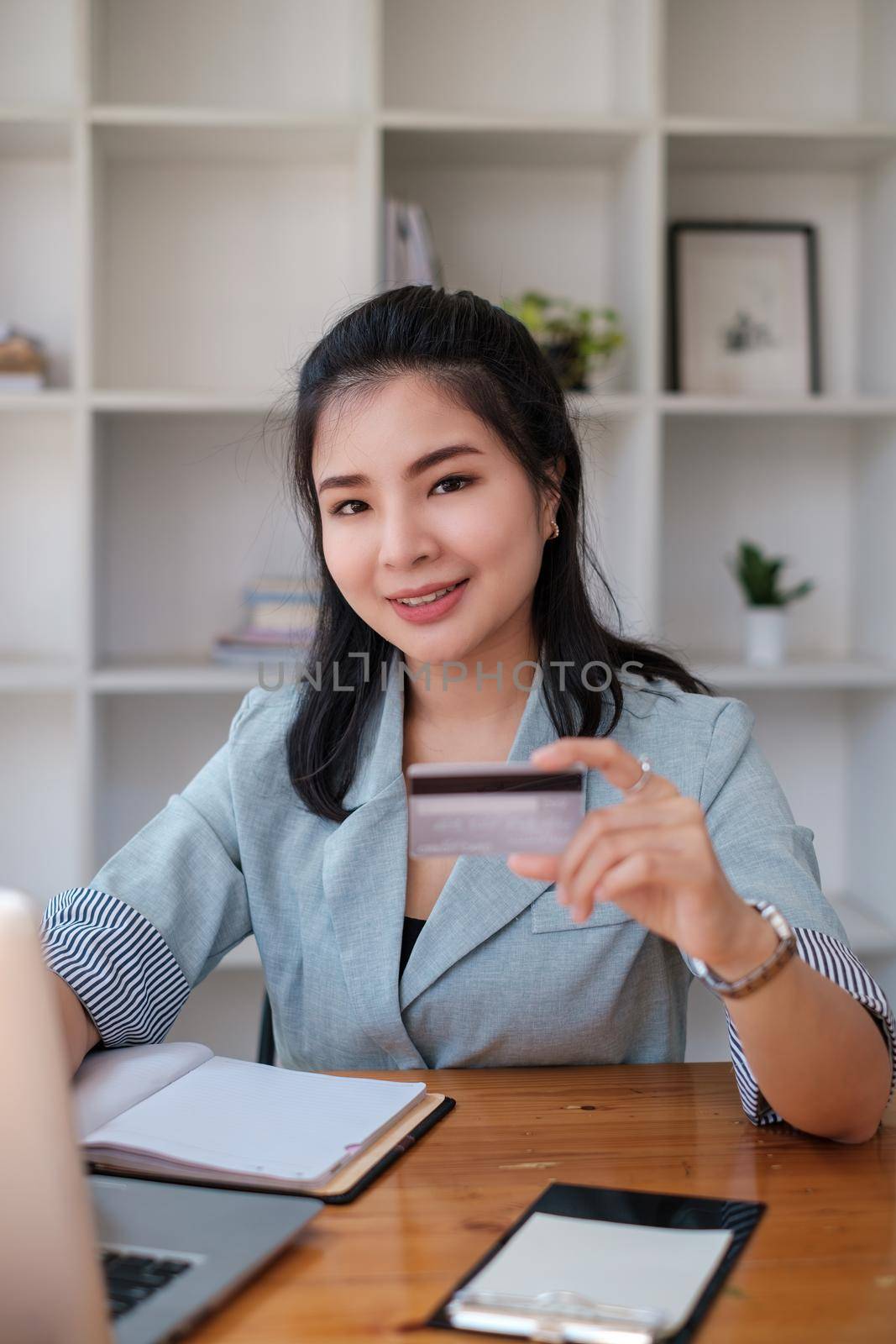 Woman enjoy with online shopping application and typing credit card for fill number to payment with virtual digital asset and metaverse