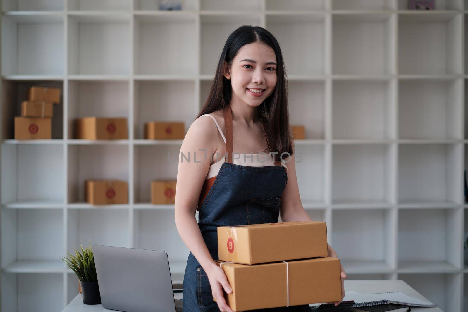 Asian small business owner working at home office. Business retail market and online sell marketing delivery, SME e-commerce concept. by itchaznong