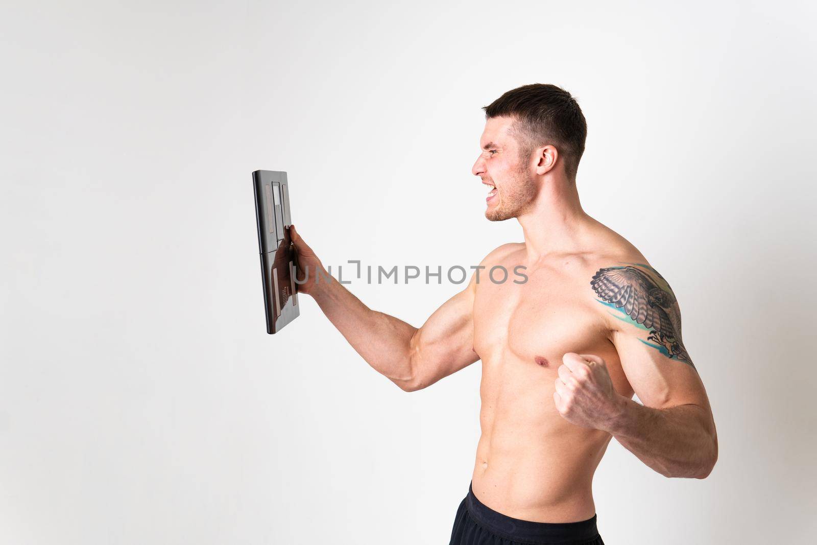 Man with weights health pondered, health and sports on a white background ache sore painful, backache person caucasian young muscular chronic. Tension neck disease suffer attractive