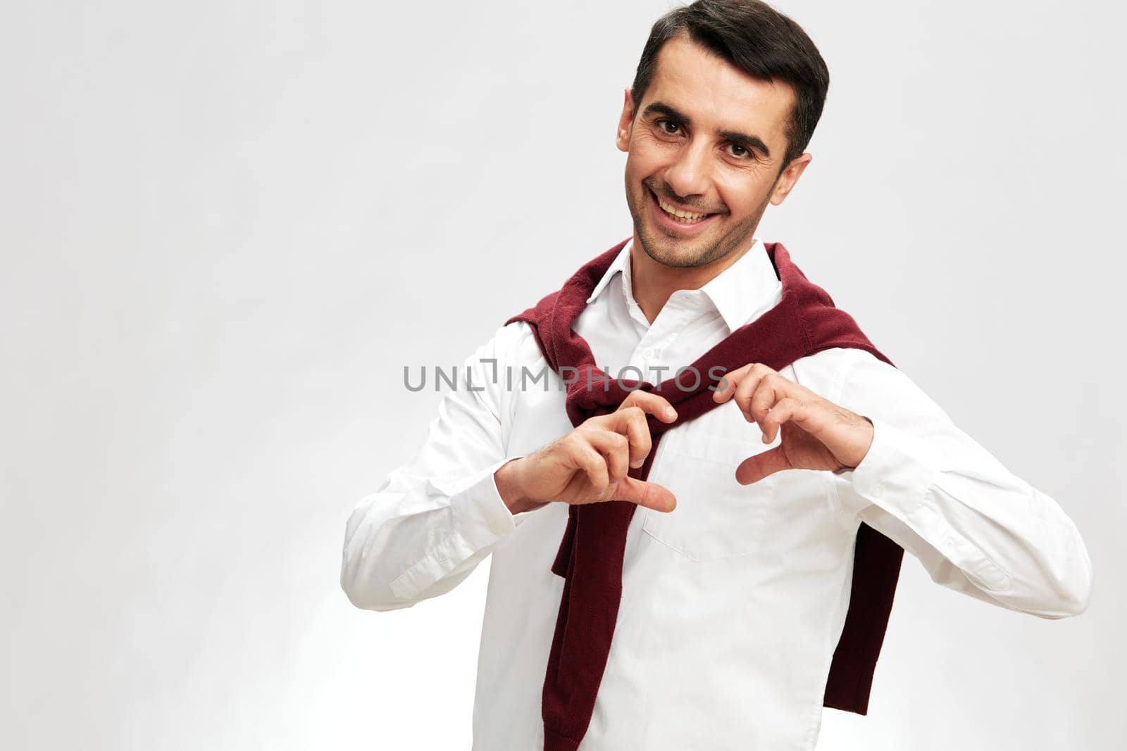 businessmen in a white shirt sweater on the shoulders pensive look glasses business and office concept. High quality photo