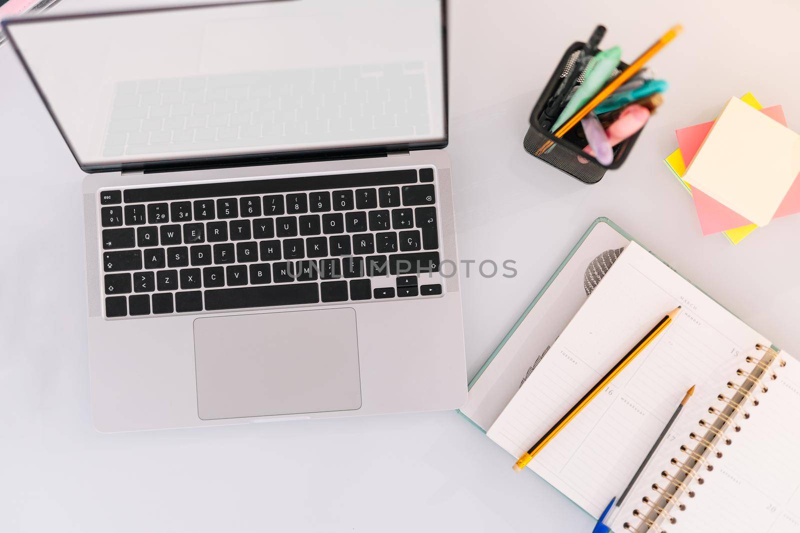 Home office work table with laptop and others by CatPhotography