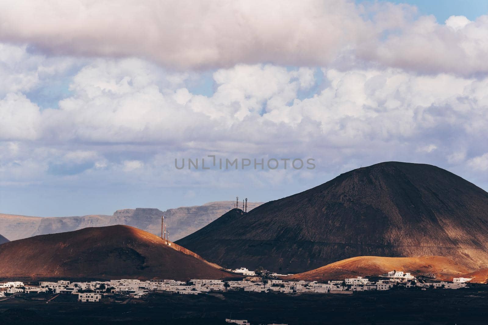 Amazing panoramic landscape of volcano craters in Timanfaya national park. Popular touristic attraction in Lanzarote island, Canary islans, Spain. Artistic picture. Beauty world. Travel concept. by kasto