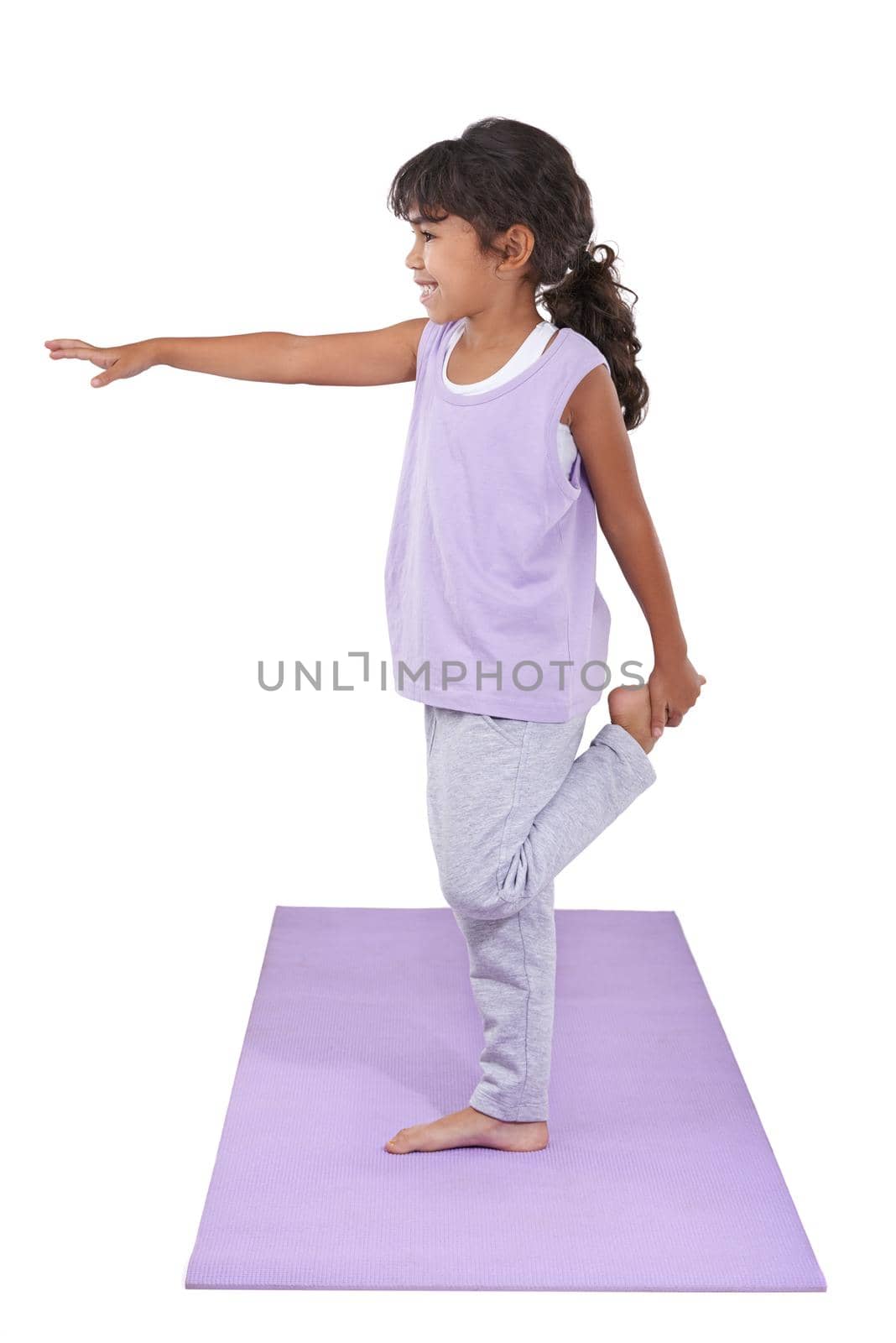Her mother introduced her to yoga. An adorable little girl practicing yoga. by YuriArcurs