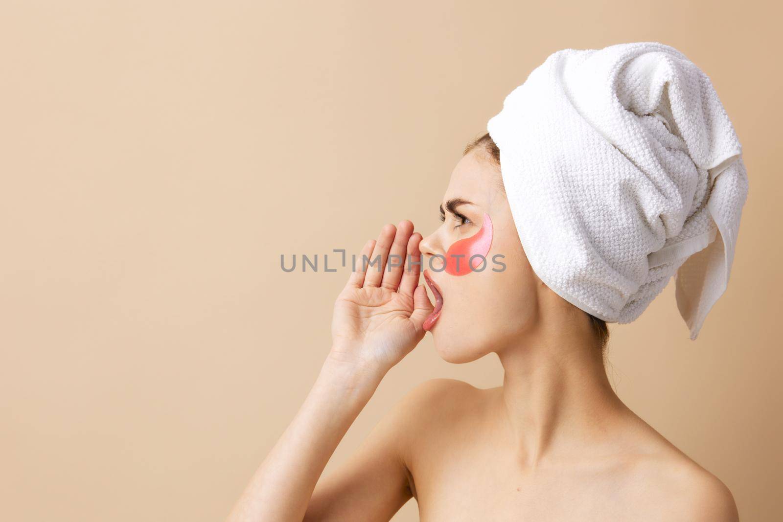 woman patches rejuvenation skin care fun beige background. High quality photo