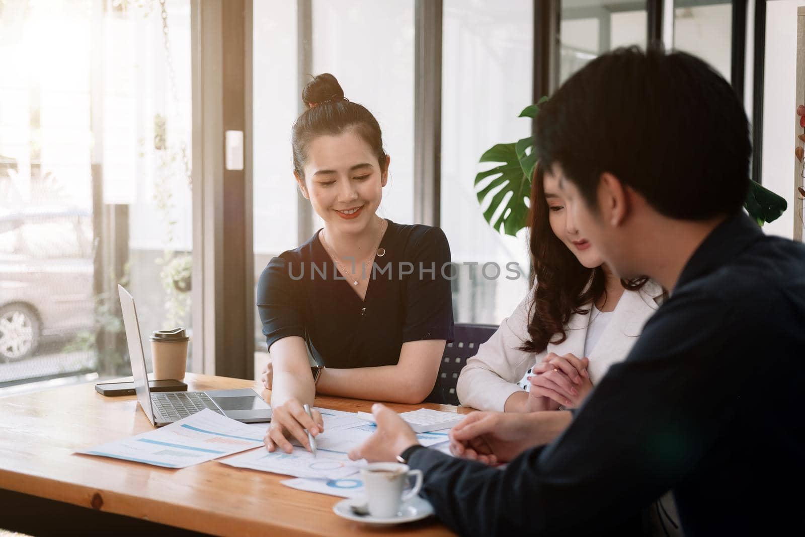 Group of young asian business financial team work together in project brainstorm meeting. Cooperate teamwork, strategy planning, small business startup company, or office coworker concept