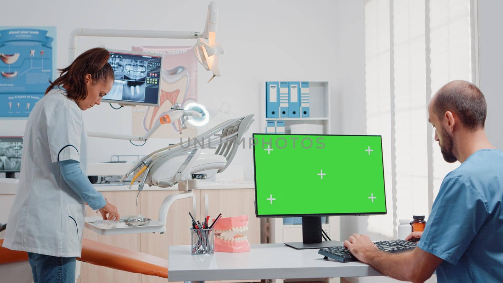 Man using monitor with horizontal green screen by DCStudio
