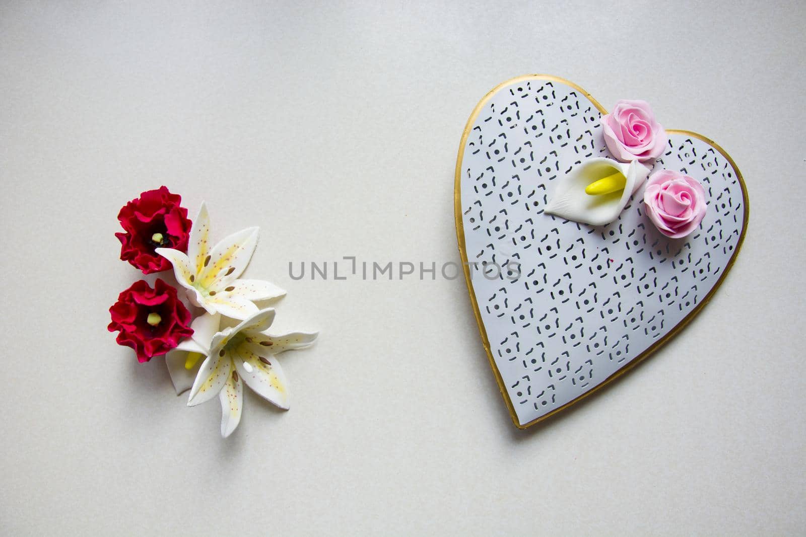 Heart ornament with colorful flowers from sugar, top view