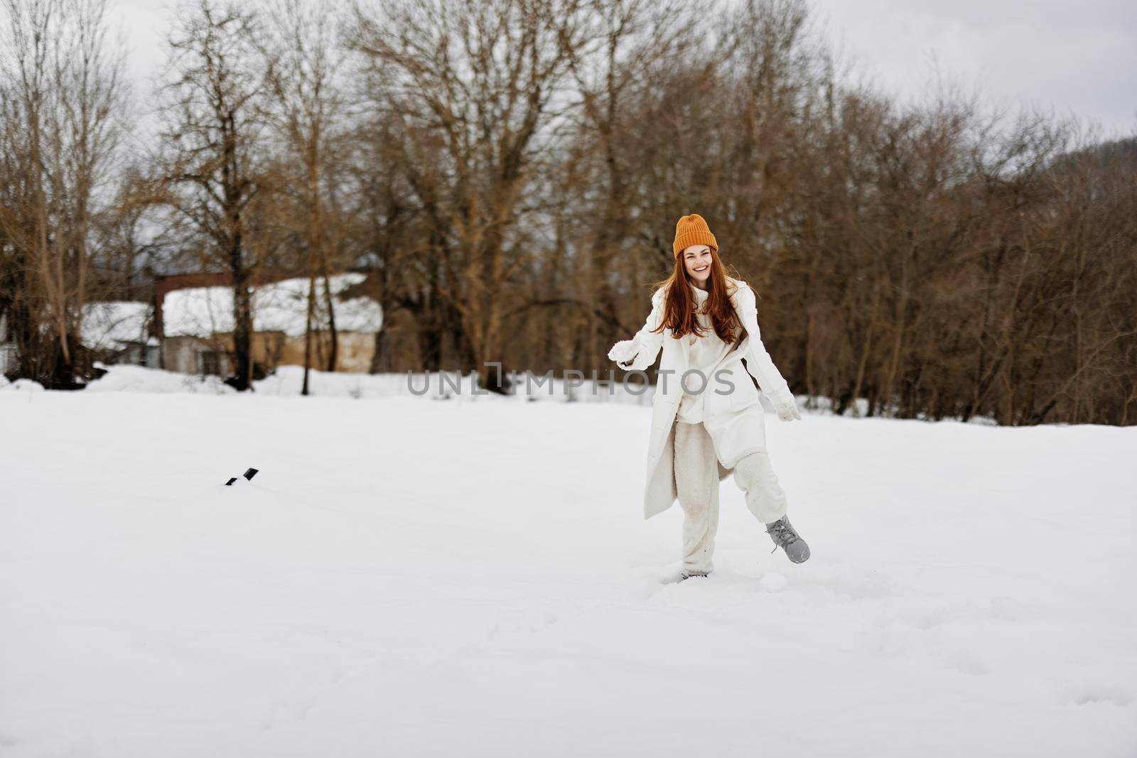 Happy young woman snowy weather walk fresh air winter holidays. High quality photo