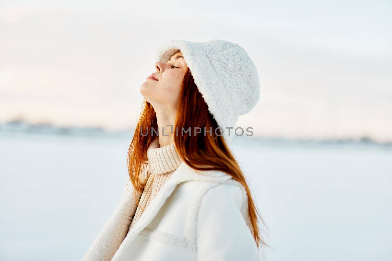 young woman winter weather snow posing nature rest travel. High quality photo