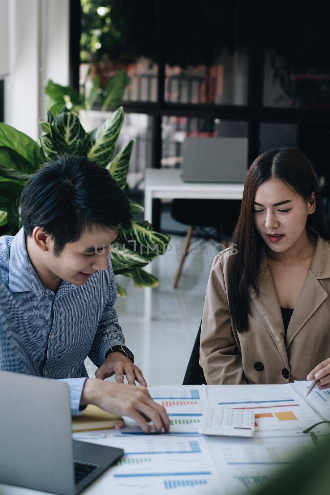 Business financial, accountant discussing with partner are meeting to audit finance planning sales to meet targets set in next year. Finance concept