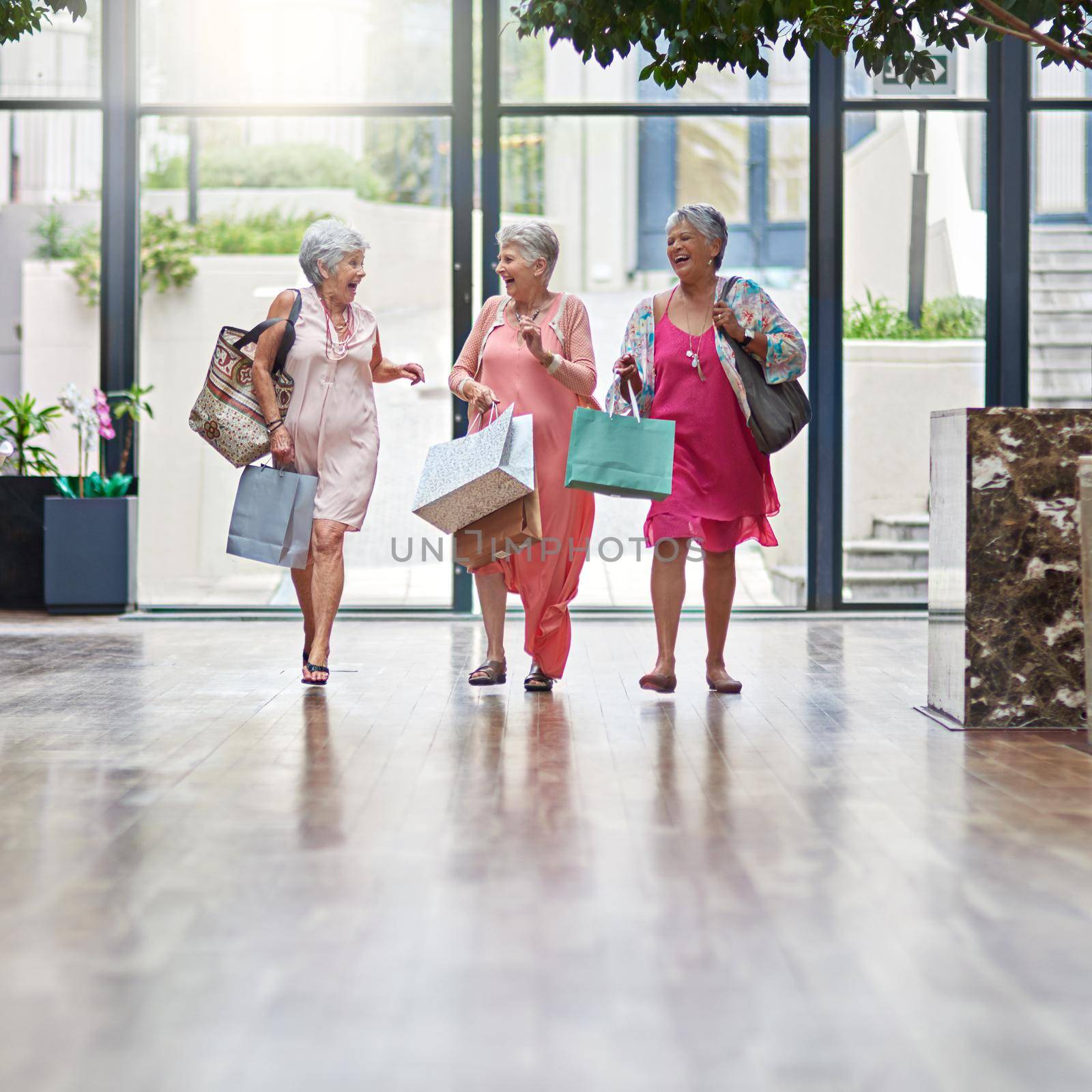 Full length shot of a three senior women out on a shopping spree.