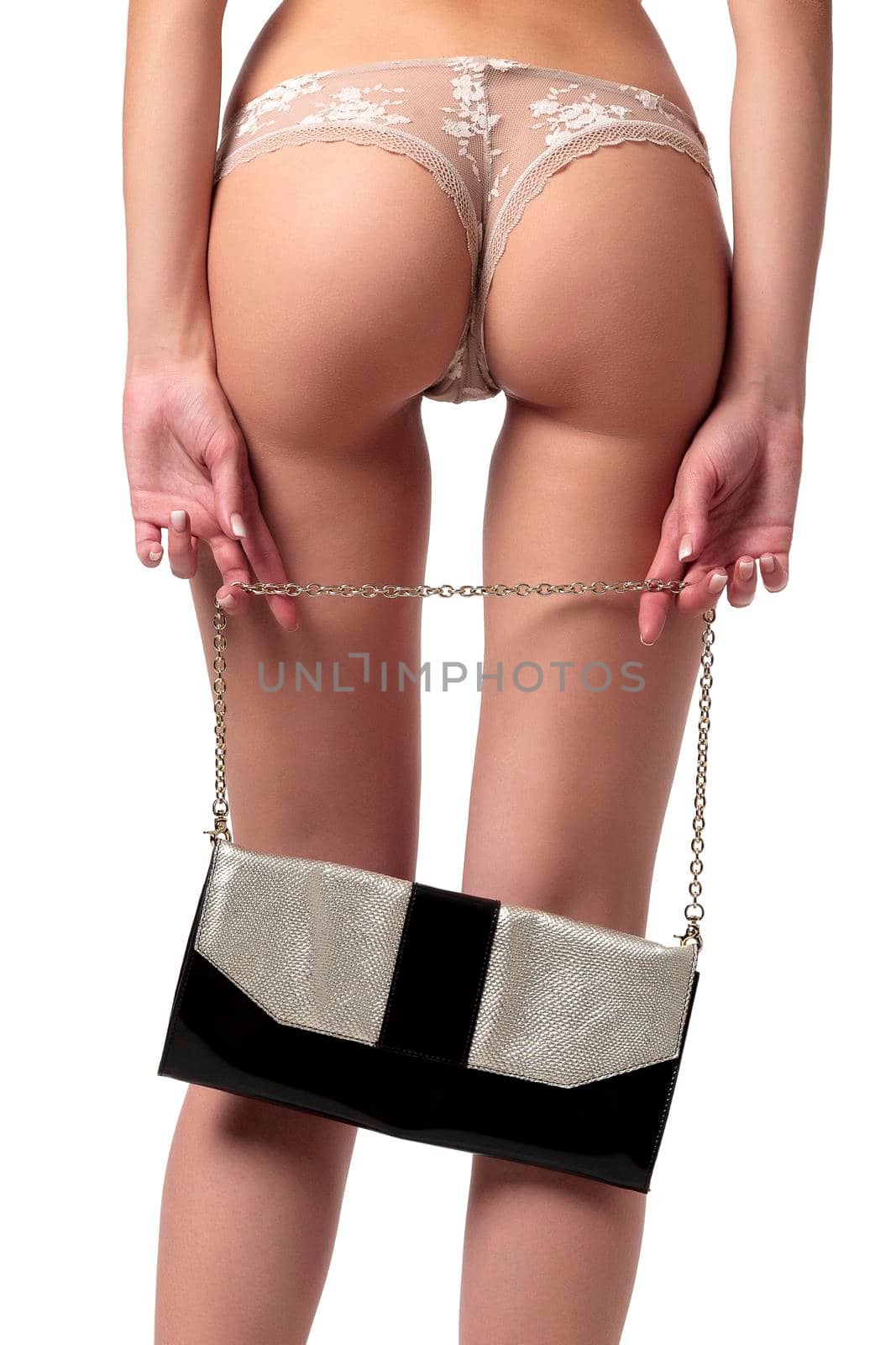 Woman with long legs holds a bag, isolated on a white background