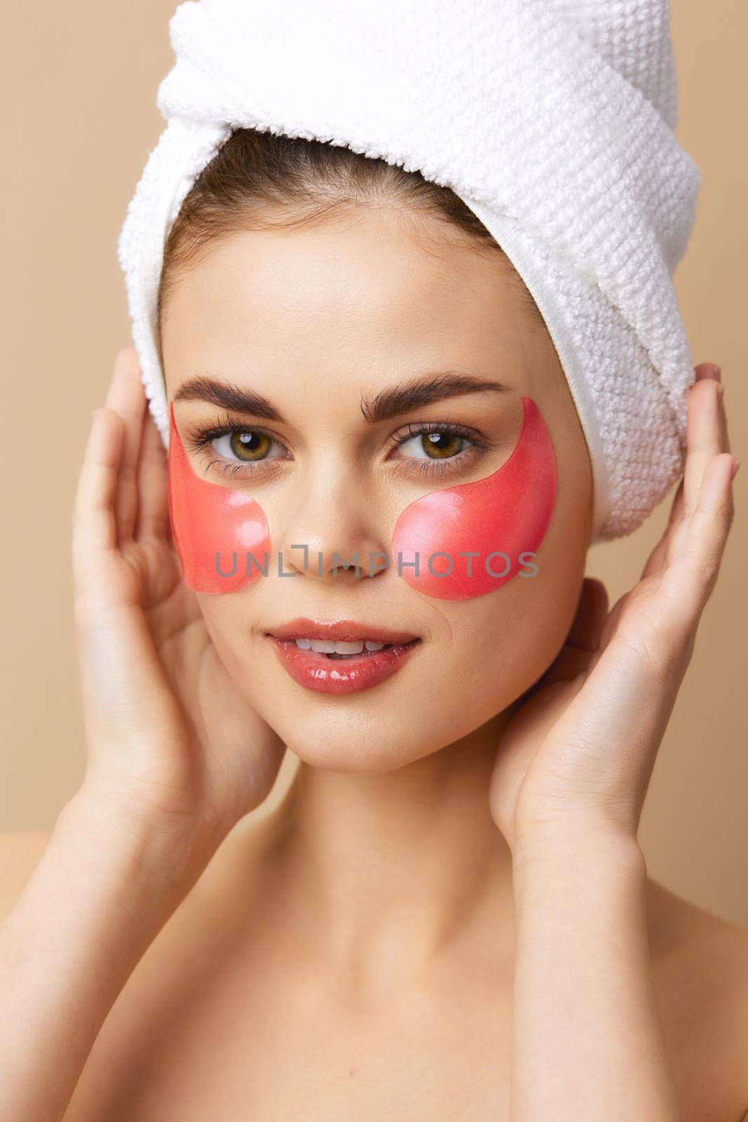 beautiful woman pink patches clean skin smile posing beige background. High quality photo