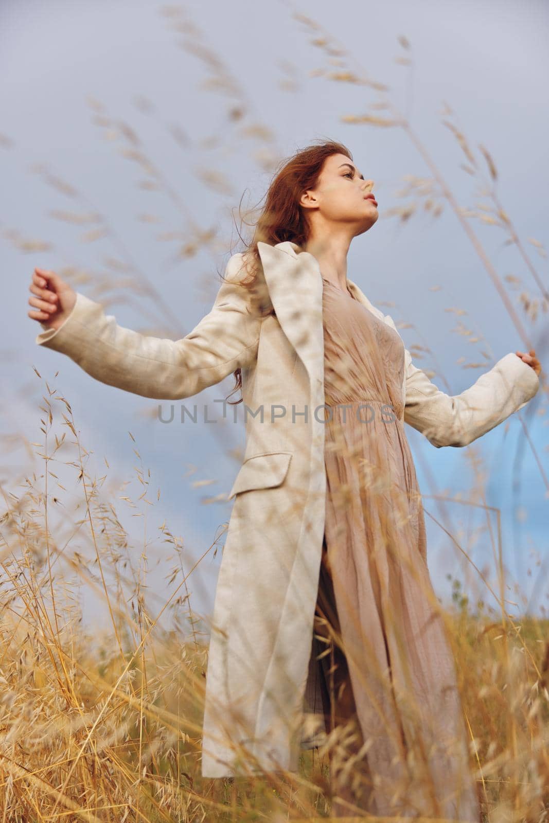 beautiful woman walk in the field autumn season concept by SHOTPRIME