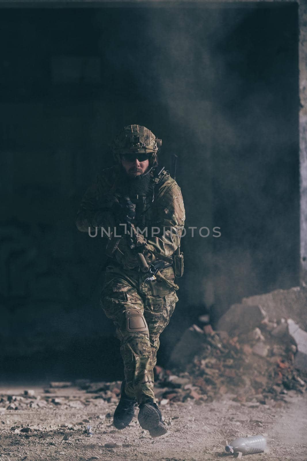 A bearded soldier in the uniform of special forces in dangerous military action in a dangerous enemy area. Selective focus. High-quality photo