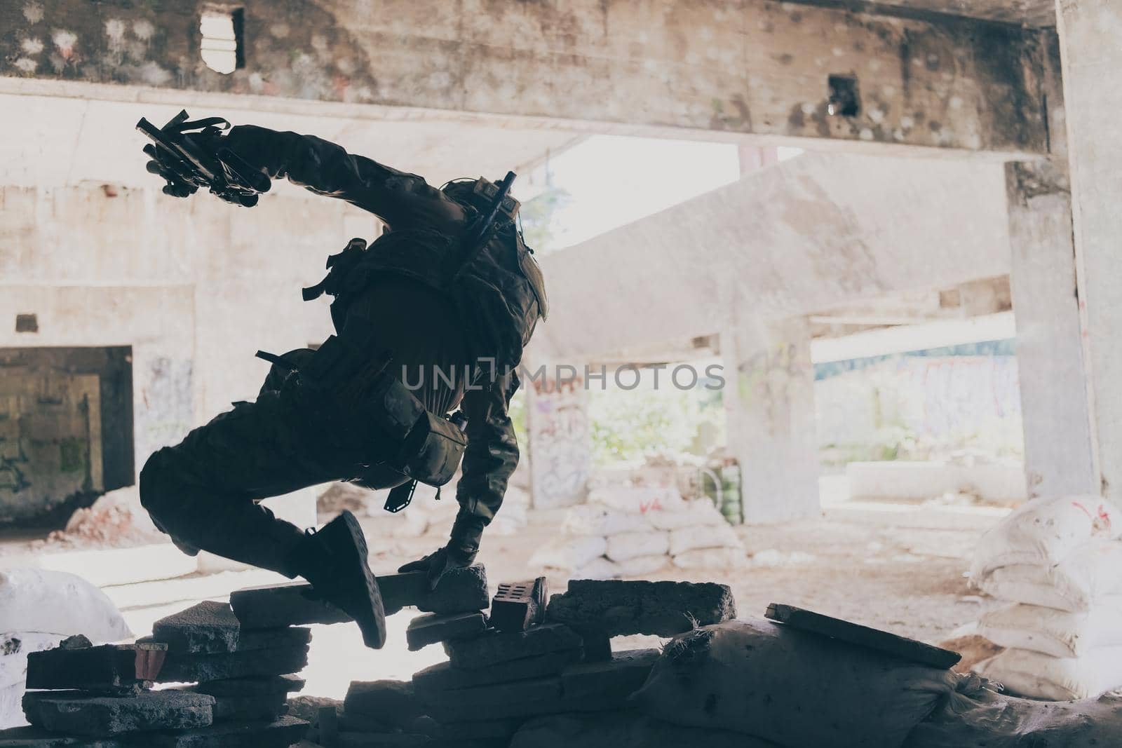 A bearded soldier in the uniform of special forces in dangerous military action in a dangerous enemy area. Selective focus. High-quality photo