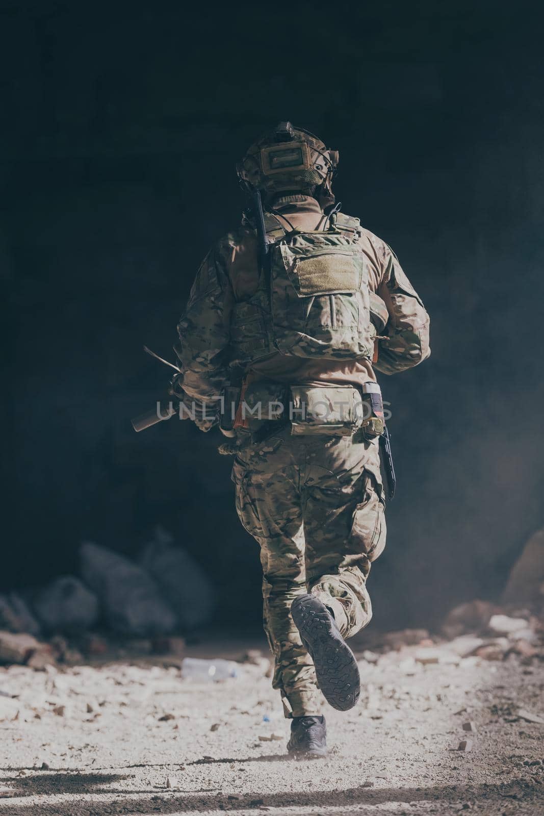 A bearded soldier in the uniform of special forces in dangerous military action in a dangerous enemy area. Selective focus. High-quality photo
