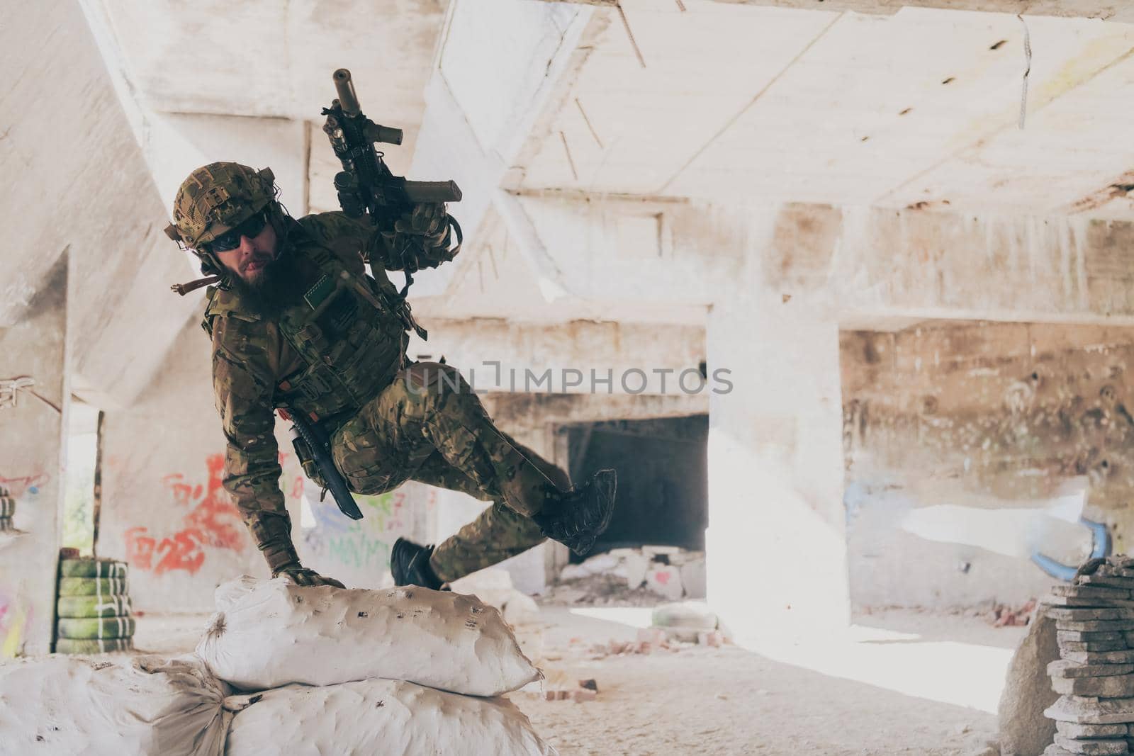 A bearded soldier in the uniform of special forces in dangerous military action in a dangerous enemy area. Selective focus. High-quality photo