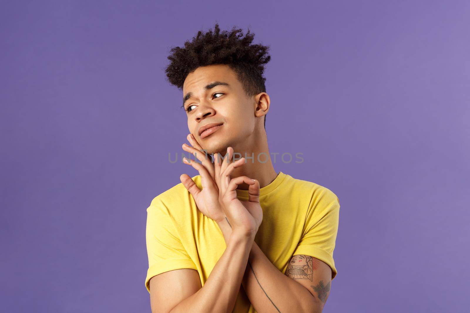 Close-up portrait of glamour beautiful young queer guy with dreads, standing in feminine model pose, gently touching face and looking away sensual, standing purple background by Benzoix