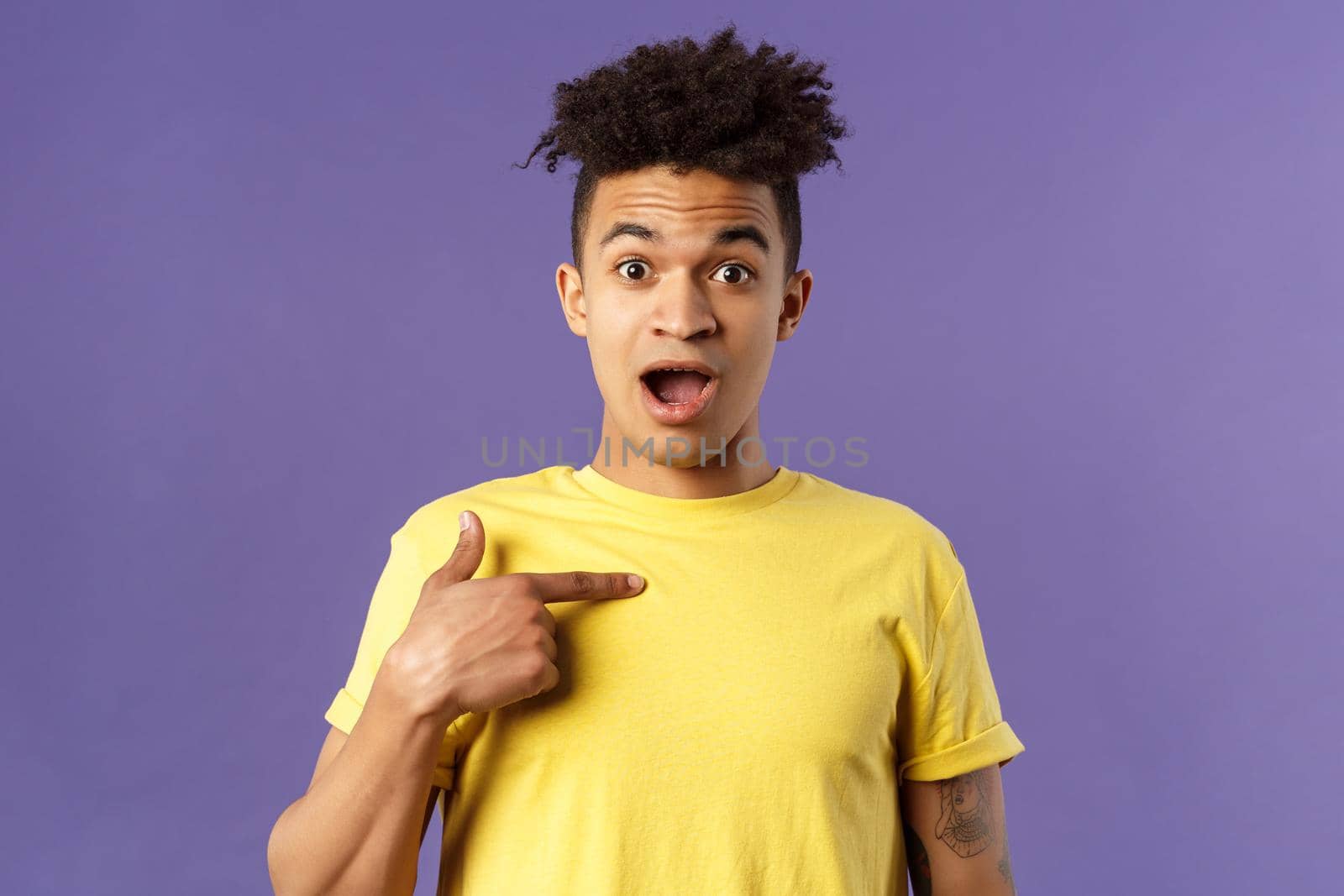 Who me, no way. Portrait of surprised, happy rejoicing young man looking with disbelies as being chosen from all candidates, pointing at himself open mouth fascinated, purple background by Benzoix