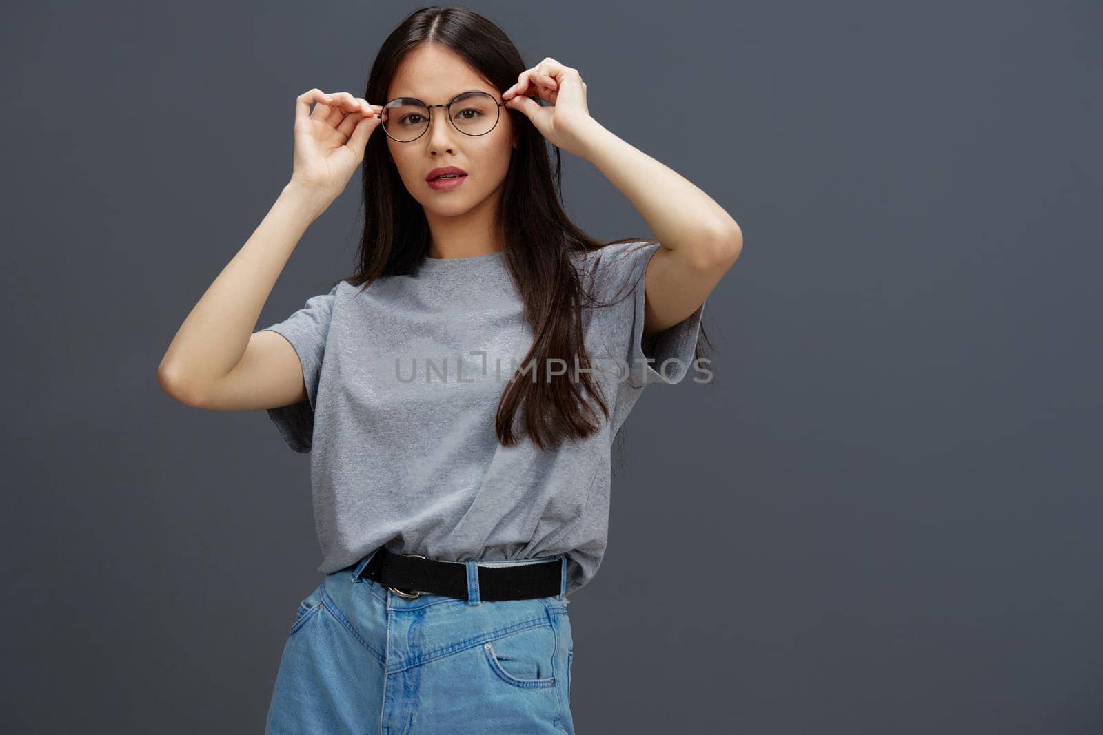 beautiful woman glasses on face fashion lifestyle gray t-shirt Gray background by SHOTPRIME